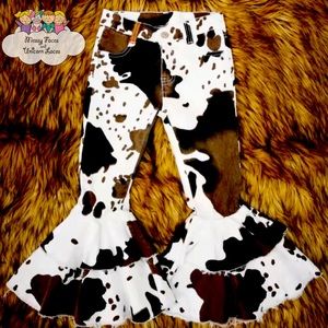 Brand new girls cow print bell bottoms.